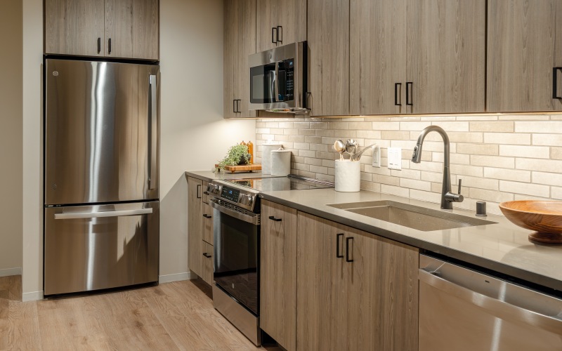 a kitchen with a bar stool and a table